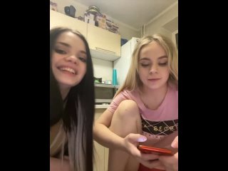 young friends are stripping in the kitchen